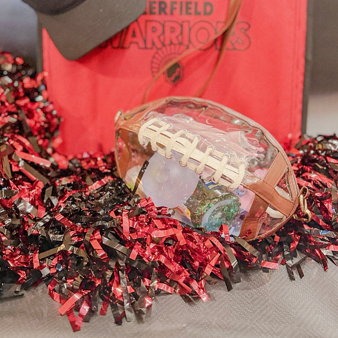 Clear football purse filled with sensory and sideline essentials