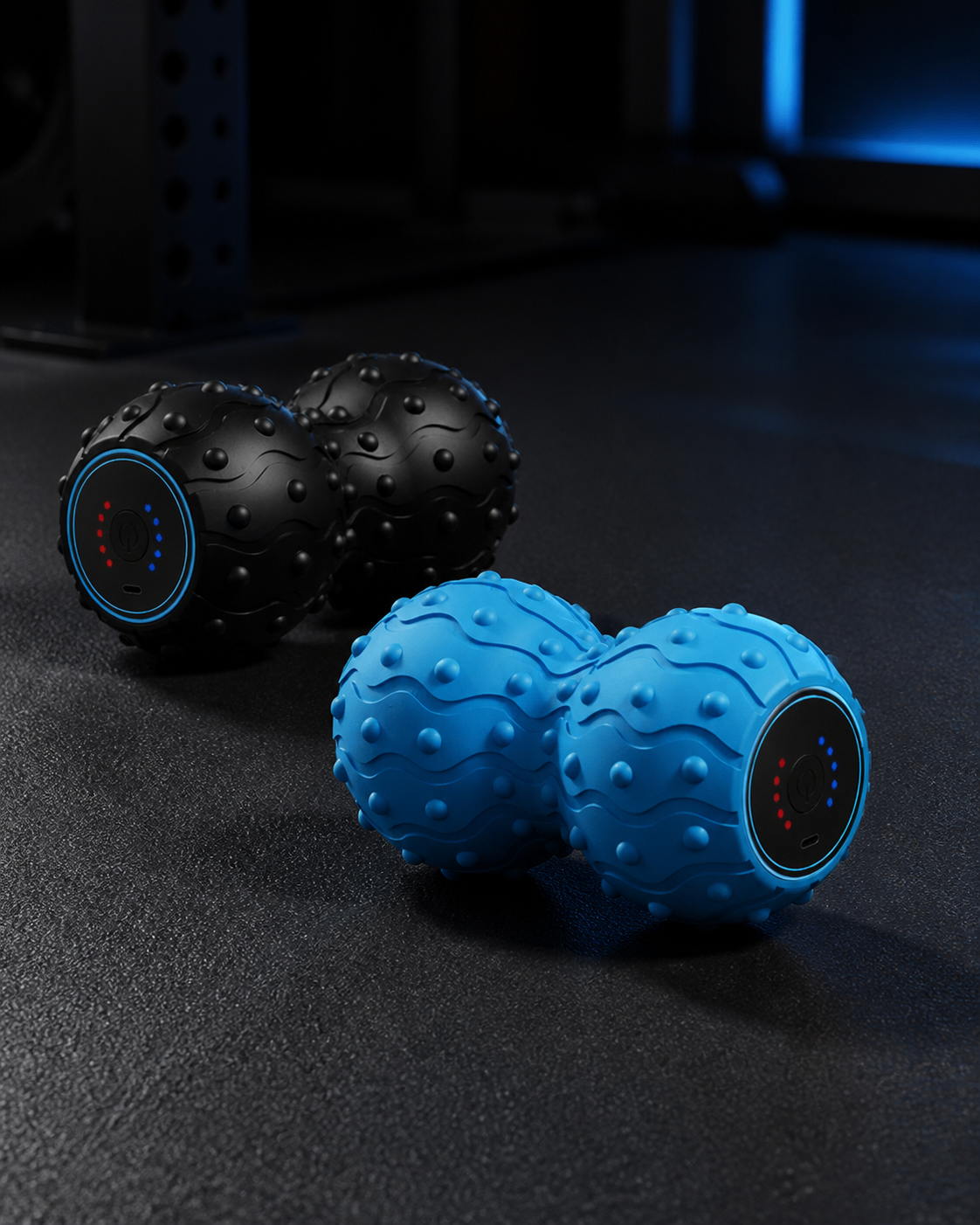 Black and blue textured vibrating peanut massage tools in an athletic recovery setting